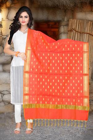 Shine Bright With This Beautiful And Attractive Dupatta In Orange Color Fabricated On Banarasi Art Silk Beautified With Weave. This Can Be Paired With Any Contrasting Colored Kurti Or Suit. Buy Now.