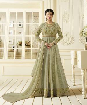 This Season Is About Subtle Shades And Pastel Play, So Grab This Designer Floor Length Suit In Pastel Green Color Paired With Pastel Green Colored Bottom And Dupatta. Its Top Is Fabricated On Georgette Paired With Santoon Bottom And Chiffon Dupatta. This Pretty Suit And Its Color Will Definitely Earn You Lots Of Compliments From Onlookers.