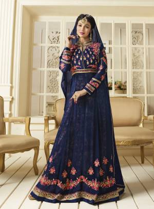 Enhance Your Perosnality Wearing This Designer Floor Length Suit In Dark Blue Color Paired With Dark Blue Colored Bottom And Dupatta. Its Top Is Fabricated On Georgette Paired With Santoon Bottom And Chiffon Dupatta. Its all Three Fabrics Ensures Superb Comfort All Day Long. Buy Now.