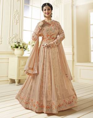 A Must Have Shade In Every Womens Wardrobe Is Here With This Designer Floor Length Suit In Peach Color Paired With Peach Colored Bottom And Dupatta. It Top Is Fabricated On Georgette Paired With Santoon Bottom And Chiffon Dupatta. It Has Very Pretty Satin Fabricated Floral Inner. Buy Now.