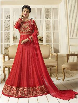 Adorn The Angelic Look Wearing This Designer Floor Length Suit In Red Color Paired With Red Colored Bottom And Dupatta. Its Top Is Fabricated On Georgette Paired With Santoon Bottom And Chiffon Dupatta. Buy This Pretty Semi-Stitched Suit Now.