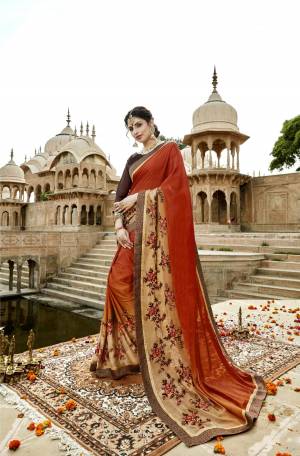 Add This New Shade To Your Wardrobe With this Designer Saree In Rust Orange Color Paired With Contrasting Brown Colored Blouse. This Saree And Blouse Are Fabricated On Art Silk Beautified With Embroidery. 