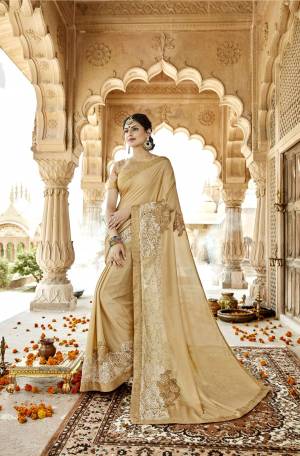 Flaunt Your Rich And Elegant Taste Wearing This Designer Elegant Saree In Beige Color Paired With Beige Colored Blouse. This Saree And Blouse Are Fabricated On Art Silk Beautified With Fancy Work. It Is Light Weight And easy To Carry All Day Long.