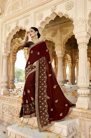 You Will Definitely Earn Lots of Compliments With This Royal Looking Designer Saree In Maroon Color Paired With Brown Colored Blouse. This Saree Is Fabricated On Georgette Paired With Art Silk Fabricated Blouse. Buy This Designer Saree Now.
