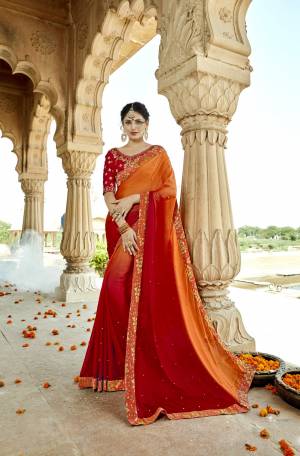 Orange and Red Color Induces Perfect Summery Appeal To Any Outfit, So Grab This Shaded Saree In Orange And Red Color Paired With Red Colored Blouse. This Saree Is fabricated On Silk Georgette Paired With Art Silk Fabricated Blouse.  Buy This Saree Now.