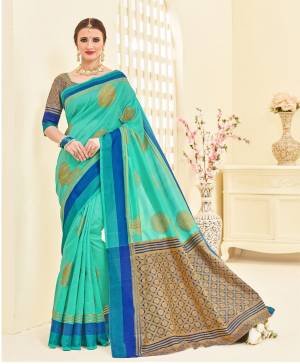 New Shade In Blue Is Here With This Saree In Tuquoise Blue Color Paired With Blue And Gold Blouse. This Saree Is Fabricated On Art Silk Paired With Brocade Fabricated Blouse. It Has Beautiful Weave All Over Making The Saree Attractive. Buy This Silk Saree Now.