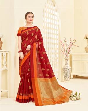 Give A Royal Look To Your Personality Wearing This Saree In Maroon Color Paired With Orange And Gold Blouse. This Saree Is Fabricated On Art Silk Paired With Brocade Fabricated Blouse. It Is Beautified With Weave All Over. Buy This Saree Now.