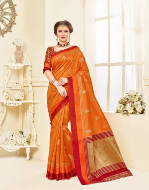 Orange Color Induces Perfect Summery Appeal To Any Outfit, So Grab This Saree In Orange Color Paired With Contrasting Maroon And Gold Blouse. This Saree IS Fabricated On Art Silk Paired With brocade Fabricated Blouse. Buy This Silk Saree Now.