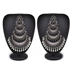 Grab This Common Color That Goes With All. Pair This Attractive Pair Of Earrings In Silver Color Beautified With Black Colored Stones With Any Colored Ethnic Attire. These Pair Of Earrings Will earn You Lots Of Compliments From Onlookers.