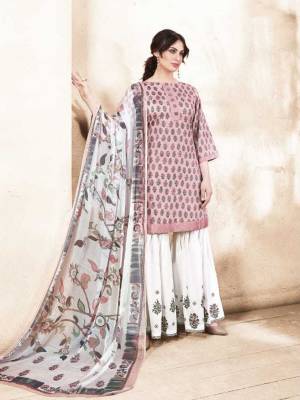 Look The Most Prettiest Of All Wearing This Straight Suit In Light Pink Colored Top Paired With White Colored Bottom And Multi Colored Dupatta. Its Top IS Fabricated On Silk Cotton Paired With Satin Cotton Bottom And Chiffon Dupatta. This Pretty Suit Will Earn You Lots Of COmpliments From Onlookers.