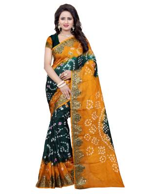 New And Unique Combination Is Here With This Saree In Pine Green And Musturd Yellow Color Paired With Pine Green Colored Blouse. This Saree And Blouse Are Fabricated On Art Silk Beautified With Bandhani Prints all Over It. 