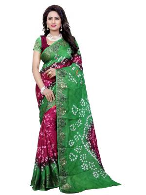 Grab This Saree In Green And Magenta Pink Color Paired With Magenta Pink Colored Blouse.This Saree And Blouse are Fabricated On Art Silk Beautified With Prints All Over It. Buy This Saree Now.