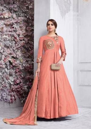Bright And Visually Appealing Color Is Here With This Designer Floor Length Suit In Dark Peach Colored Top Paired With Dark Peach Colored Bottom And Dupatta. Its Top Is Fabricated On Art Silk Paired With Santoon Bottom And Chiffon Dupatta. Buy This Readymade Suit Now.