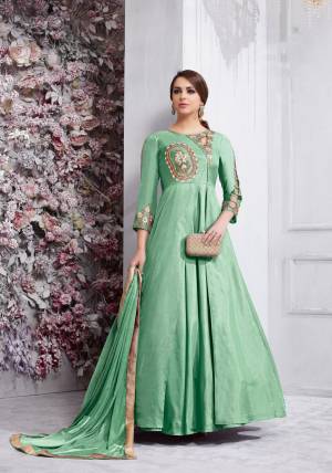 Bright And Visually Appealing Color Is Here With This Designer Floor Length Suit In Sea Green Colored Top Paired With Sea Green Colored Bottom And Dupatta. Its Top Is Fabricated On Art Silk Paired With Santoon Bottom And Chiffon Dupatta. Buy This Readymade Suit Now.