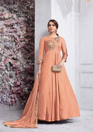 Bright And Visually Appealing Color Is Here With This Designer Floor Length Suit In Light Peach Colored Top Paired With Light Peach Colored Bottom And Dupatta. Its Top Is Fabricated On Art Silk Paired With Santoon Bottom And Chiffon Dupatta. Buy This Readymade Suit Now.