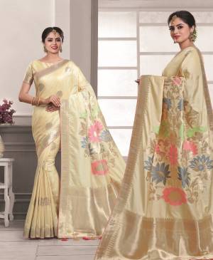 Simple, Rich And Elegant Looking Saree Is Here In Cream Color Paired With Cream Colored Blouse. This Saree And Blouse Are Fabricated On Art Silk Beautified With Weaving And Stone Work. Buy This Simple Saree Now.