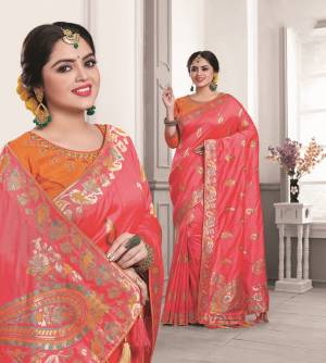 Shine Bright In This Lovely Dark Pink Colored Saree Paired With Orange Colored Blouse. This Saree And Blouse Are Fabricated On Art Silk Beautified With Weaving And Embroidery. Buy This Designer Silk Saree.