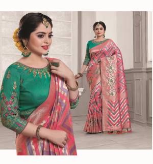 Look Pretty Wearing This Designer Silk Saree In Dusty Pink Color Paired With Contrasting Sea Green Colored Blouse. This Saree And Blouse Are Fabricated On Art Silk Beautified With Weave And Embroidery. Buy Now.