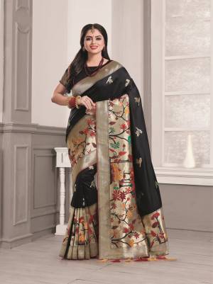 Bold And Beautiful Look Is Here With This Designer Silk Saree In Black Color Paired With Black Colored Blouse. This Saree And Blouse are Fabricated On Art Silk Beautified With Weave And Lace Border.