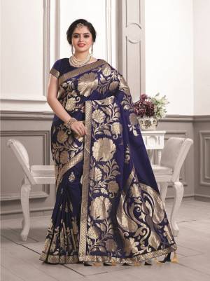 Enhance Your Personality Wearing This Beautiful And Rich Saree In Navy Blue Color Paired With Navy Blue Colored Blouse. This Saree And Blouse Are Fabricated On Art Silk Beautified With Bold Weave All Over The Saree. Buy Now.