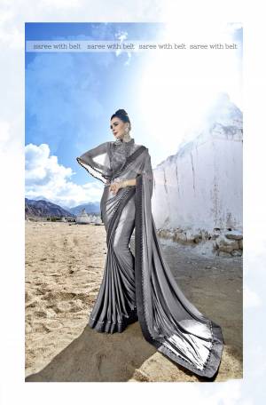 Flaunt Your Rich And Elegant Taste Wearing This Designer Saree In Grey Color Paired With Grey Colored Blouse. This Saree Is Fabricated On Lycra Paired With Net Fabricated Blouse. It Has Fancy Embroidered Blouse And Belt. 