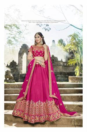Shine Bright Wearing This Designer Lehenga Choli In Rani Pink Color Paired With Rani Pink Colored Blouse. This Lehenga Choli Is Fabricated On Soft Silk Paired With Chiffon Dupatta. All Its Fabric Ensures Superb Comfort All Day Long. Buy Now.