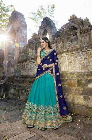 Shades Of Blue Gives A Fresh And Attractive Look Everytime You Wear This Designer Lehenga, Grab This Beautiful Designer Lehenga Choli In Turquoise Blue Color Paired With Royal Blue Colored Dupatta. Its Blouse And Lehenga Are Fabricated On Soft Silk Paired With Chiffon Dupatta. Buy This Designer Lehenga Choli Now.