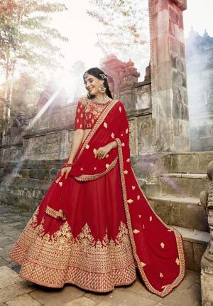Adorn The Pretty Angleic Look Wearing this Heavy And Attractive Designer Lehenga Choli In Pure Red Color Paired With Red Colored Dupatta. Its Blouse And Lehenga Are Fabricated On Soft Silk Paired With Chiffon Dupatta. Buy This Lehenga Choli Now.
