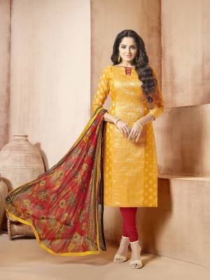 Celebrate This Festive With Colors And Comfort Wearing this Suit In Yellow Colored Top Paired With Contrasting Red Colored Bottom And Dupatta. Its Top Is Fabricated On Banarasi Art Silk Paired With Cotton Bottom And Chiffon Dupatta. Buy This Dress Material Now.