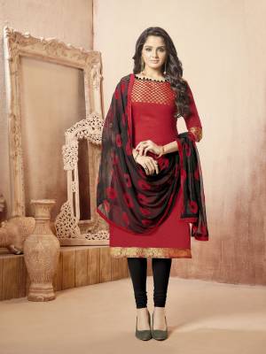 Pretty Common Color Combination Is Here With This Dress Material In Red Color Paired With Black Colored Bottom And Dupatta. Its Top IS Fabricated On Banarasi Art Silk Paired With Cotton Bottom and Chiffon Dupatta. Buy This Dress Material Now.
