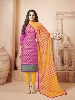 Bright Colors Always Gives An Attractive Look To Your Personality, So Grab This Dress Material In Rani Pink Color Paired With Contrasting Yellow Colored Bottom And Dupatta. Its Top IS Fabricated On Banarasi Art Silk Paired With Cotton Bottom And Chiffon Dupatta. 