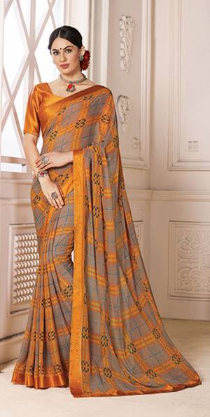 Celebrate This Festive Season Wearing This Pretty Light Weight Saree In Grey And Musturd Yellow Color Paired With Musturd Yellow Colored Blouse. This Saree IS Fabricated On Georgette Paired With Satin Fabricated Blouse. It Has Pretty Checks Prints All Over It.