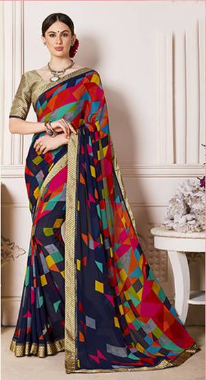 If You Are Fond Of Color Than Grab This Pretty Colorful Saree In Multi And Navy Blue Color Paired With Beige Colored Blouse. This Saree Is Fabricated On Georgette Paired With Satin Fabricated Blouse. It Is Light Weight And Easy To Carry All Day Long.