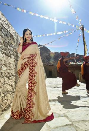 Flaunt Your Rich And Elegant Taste Wearing This Designer Saree In Beige Color Paired With Maroon Colored Blouse. This Saree Is Fabricated On Satin Silk Paired With Art Silk Fabricated Blouse. It Has Atractive Embroidered Lace Border Which Is Making The Saree More Graceful.