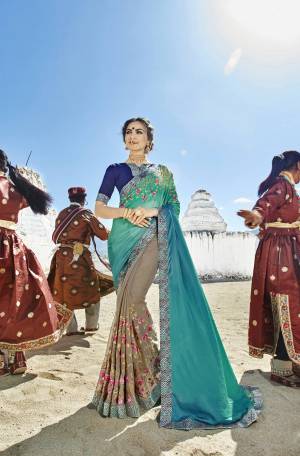Lovely Color Pallete Is Here with This Beautiful Designer Saree In Blue And Grey Color Paired With Navy Blue Colored Blouse. This Saree Is Fabricated On Silk And Georgette Paired With Art Silk Fabricated Blouse. It Is Beautified With Contrasting Embroidery Making It Attractive.