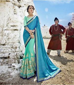 Shades In Blue Gives A Fresh Look Every Time You Wear It, Add This Designer Saree In Turquoise Blue And Aqua Blue Colored To Your Wardrobe Paired With Aqua Blue Colored Blouse. This Saree IS Fabricated On Art Silk And Georgette Paired With Art Silk Fabricated BLouse. Buy Now.