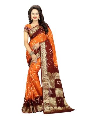Orange Color Induces Perfect Summery Appeal To Any Outfit, So Grab This Saree In Orange And Maroon Color Paired With Orange And Maroon Colored Blouse. This Saree And Blouse are Fabricated On Art Silk Beautified With Bandhani Prints All Over. Buy This Saree Now.