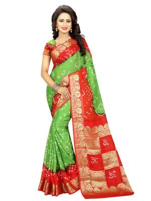 Pure Traditional Combination Is Here With this Saree In Green And Red Color Paired With Red And Green Colored Blouse. This Saree And Blouse are Fabricated On Art Silk Beautified With Bandhani Prints. 