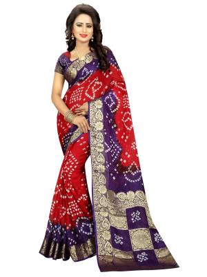 Adorn the Pretty Angelic Look with this Attractive Combination In Red And Purple Colored Saree. This Saree And Blouse are Fabricated On Art Silk Beautified With Bandhani Prints.