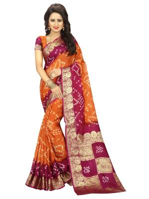 Grab This Art Silk Fabricated Saree In Orange And Magenta Pink Color Paired With Orange Colored Blouse. This Saree And Blouse Are Fabricated On Art Silk Beautified With Bandhani Prints.