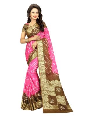 Look Pretty Draping This Lovely Saree In Pink And Brown Color Paired With Pink Colored Blouse. This Saree And Blouse Are Fabricated On Art Silk Beautified With Weave And Bandhani Prints.