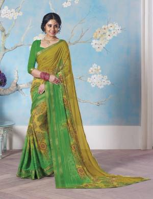 Go With The Shades Of Green With This Saree In Pear Green And Green Color Paired With Green Colored Blouse. This Saree And Blouse Are Fabricated On Georgette. Its Fabric Ensures Superb Comfort All Day Long.