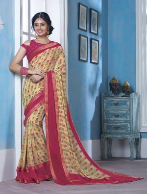 Look Pretty In This Printed Light Yellow Colored Saree Paired With Comtrasting Dark Pink Colored Blouse. This Saree And Blouse Are Fabricated On Georgette Beautified With Small Floral Prints All Over.
