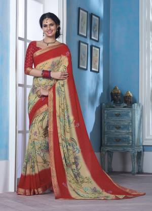 For Your Casual Wear, Grab This Saree In Cream And Red Color Paired With Red Colored Blouse. This Saree Is Fabricated On Georgette Paired With Borcade Fabricated Blouse, Beautified With Prints .