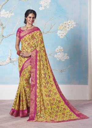 Add This Pretty Saree In Yellow To Your Wardrobe Paired With Contrasting Pink Colored Blouse. This Saree And Blouse Are Fabricated On Georgette Beautified With Prints And Lace Border. It Is Light Weight And Easy To Carry All Day Long.