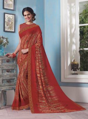 Adorn the Pretty Angelic Look Wearing This Attractive And Elegant Red Colored Saree Paired With Red Colored Blouse. This Saree And Blouse Are Fabricated On Georgette Beautified With Prints.