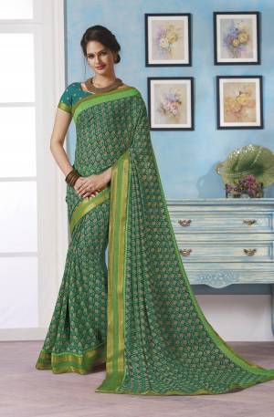 Add Some Casuals With This Simple Saree In Green Color Paired With Green Colored Blouse. This Saree Is Fabricated On Georgette Paired With Brocade Fabricated Blouse, Its Fabric Ensures Superb Comfort And Earn You Lots Of Complients.