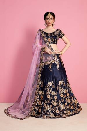 Enhance Your Personality In This Heavy Designer Lehenga Choli In Navy Blue Color Paired With Contrasting Light Pink Colored Dupatta. This Lehenga Choli Is Fabricated On Velvet Silk Paired With Net Fabricated Dupatta. It Has Heavy Embroidery Which Is Making This Lehenga Choli Attractive.