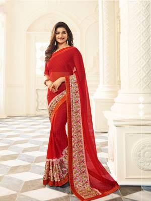 Adorn The Pretty Agelic Look Wearing This Simple And Elegant Looking Red Colored Saree Paired With Red Colored Blouse. This Saree Is Fabricated On Georgette Paired With Art Silk Fabricated Blouse. It Is Beautified With Prints All Over And Printed Satin Patta.