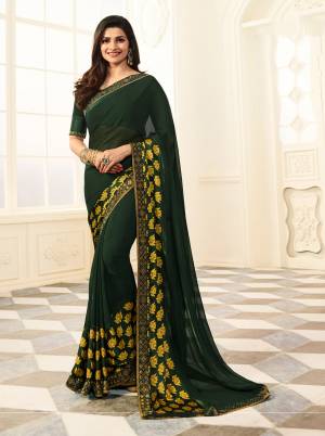 Add This Lovely Shade In Saree To Your Wardrobe With This Pine Green Colored Elegant Saree Paired With Pien Green Colored Blouse. This Saree Is Fabricated On Georgette Paired With Art Silk Fabricated Blouse, Beautified With Printed Satin Patta.